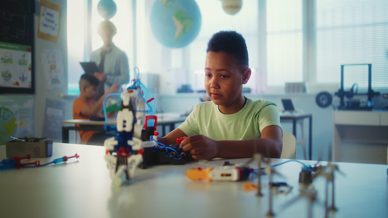 Student building a robot in a STEM classroom