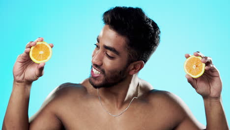 skincare, orange and face of man in studio