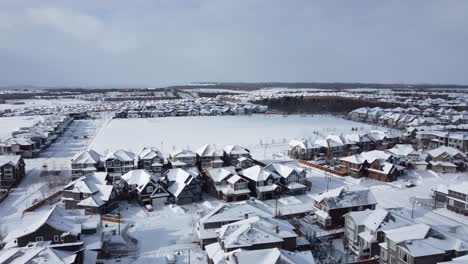 Aerial-view-of-a-suburban-community-in-Calgary,-Alberta-in-winter