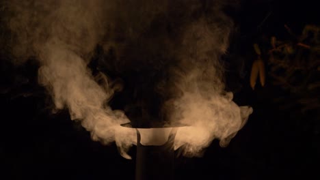 White-Smoke-Coming-Out-From-Chimney-Pipe-On-A-Roof-Of-A-Hosue-At-Night-In-The-Norwegian-Village-In-Arendel,-Zagorow,-Poland