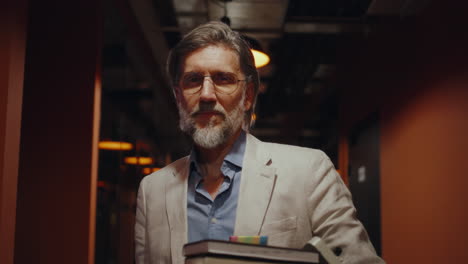 sad office worker man stand look around with box of personal stuff lose a job got fired due to a sad office worker man stand look around with box of personal stuff lose a job got fired due to a coronavirus crisis unemployed depression business corporate employment economy slow motion