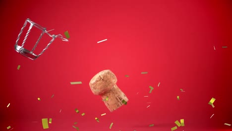 golden confetti falling over wine cork falling against red background