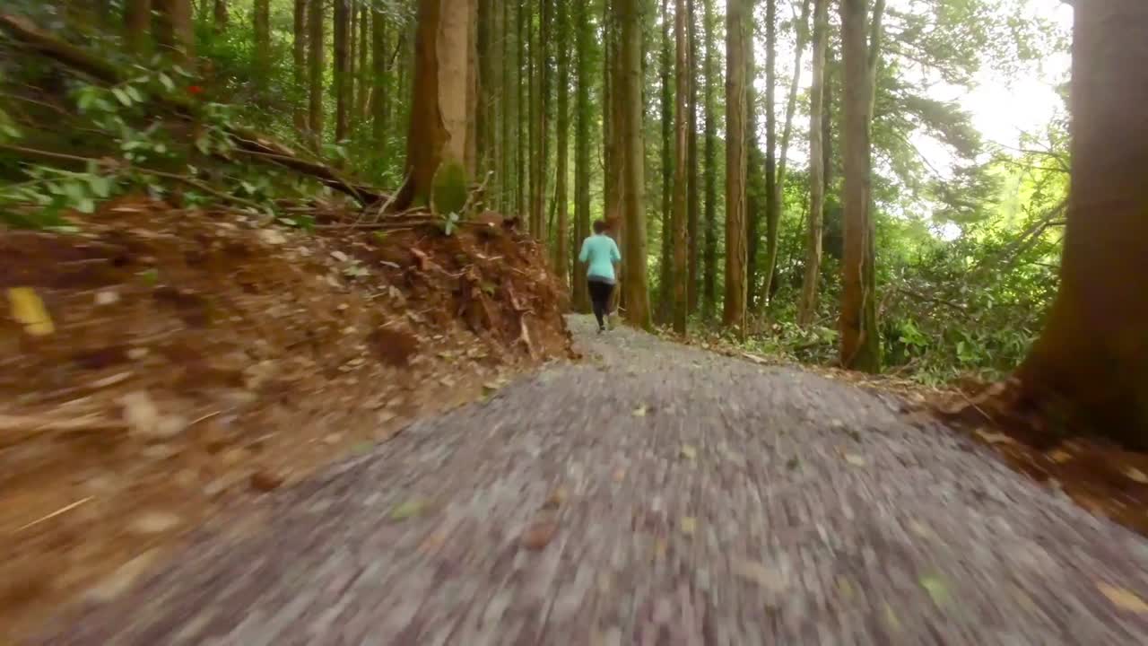 Drone footage of woman jogging