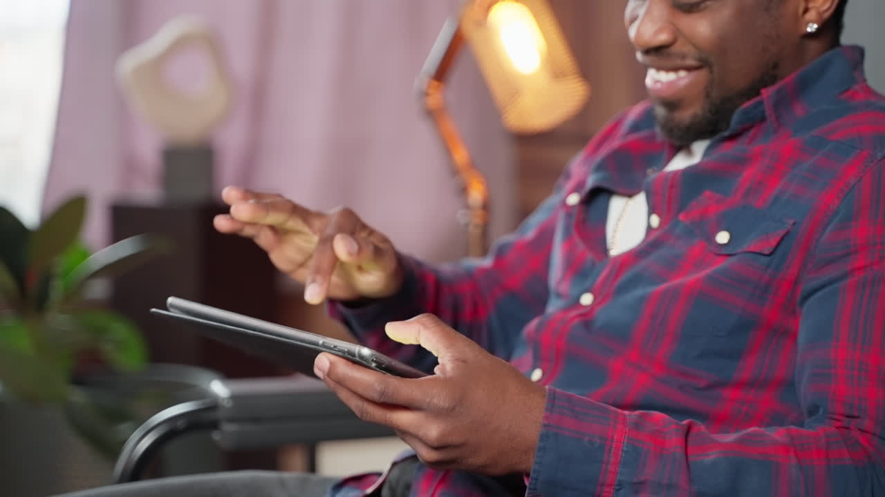 Man using tablet at home