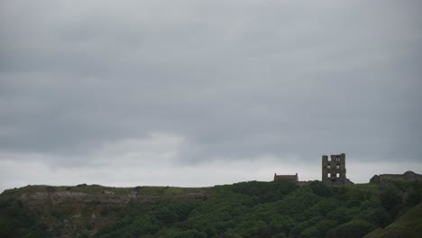 the ruins of scarborough castle set against a overcast, cloudy sky