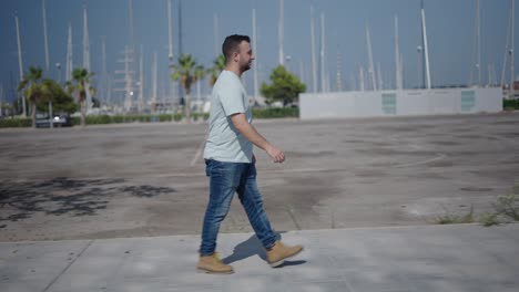 man walking in a city parking lot