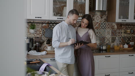 couple planning in the kitchen