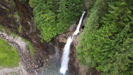 Beautiful-white-water-cascading-through-dense-evergreen-forest,-Franklin-Falls,-WA,-aerial