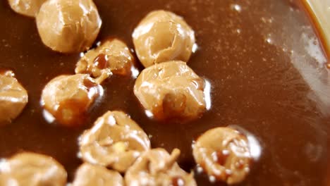 caramel balls in melted chocolate 4k