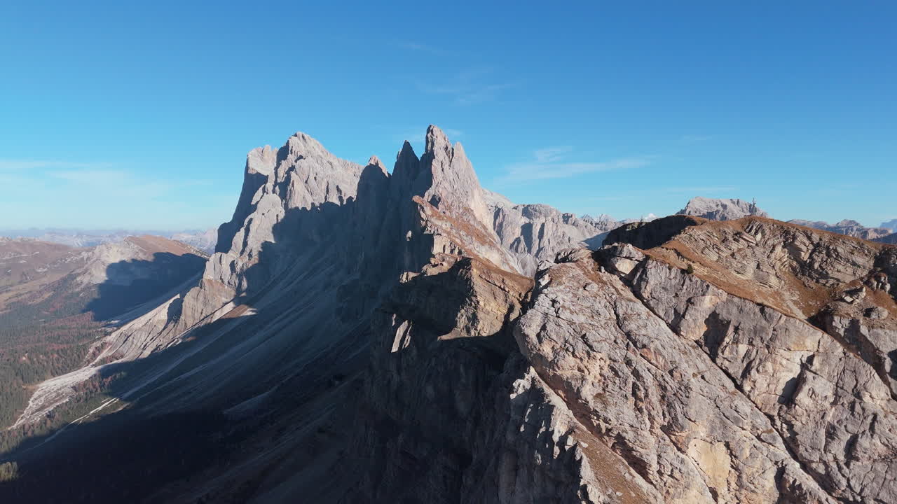 Drone view of Seceda Ridgeline with iconic Fermeda Towers and chairlift, Italy