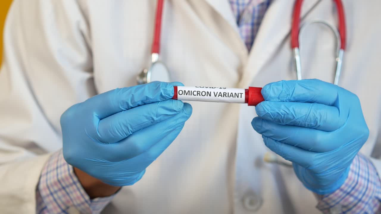 Doctor Holding COVID-19 Omicron Variant Test Tube
