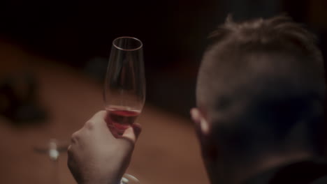 man tasting rose wine