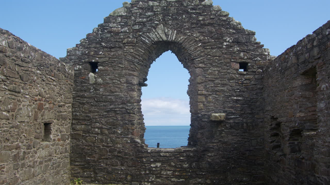 Mid shot looking though the east end window inside of St Ninian’s Chapel, Isle head, Isle of Whithorn