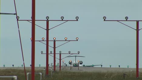 a jet airplane lands on an airport runway 1