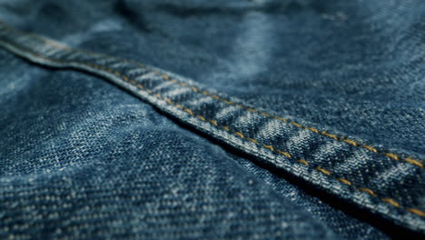 blue textile jeans cloth texture close-up macro. fashion fabric multicolor. cotton casual clothes