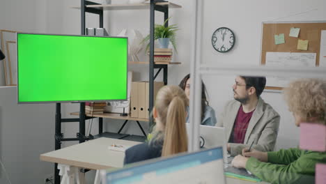 business meeting in modern office with green screen