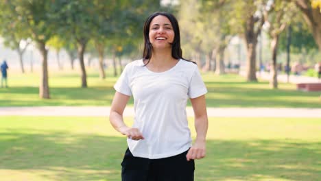 Indian-girl-doing-jumping-exercise-in-a-park-in-morning