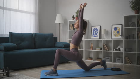 slender lady is stretching body during daily workout at home prevention of osteochondral disease yoga and meditation at morning time