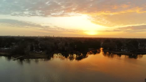 shot over portsmouth, a drone reveal of the city of norfolk virginia bathed in golden light of the morning sunrise