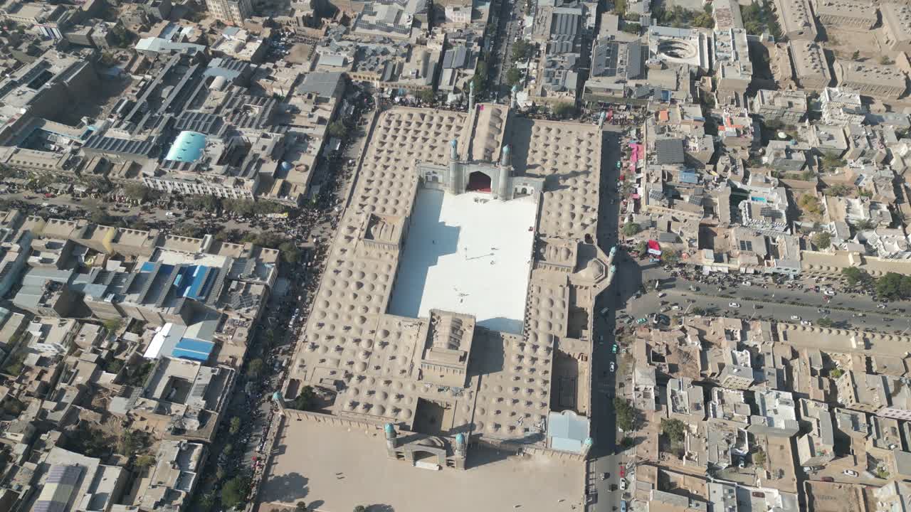 Drone Shot of Herat Central Blue Mosque, Afghanistan. Shrine, Street Traffic and Neighborhood Buildings