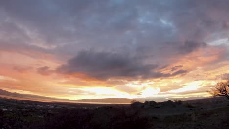 Aerial-FPV-view-of-Utah-Valley-at-sunset-during-autumn-behind-big-wasatch-mountain-in-Slate-Canyon-in-Provo-Utah