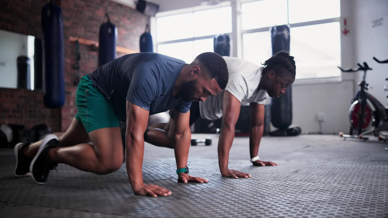 Men Doing Workout Routine in Gym