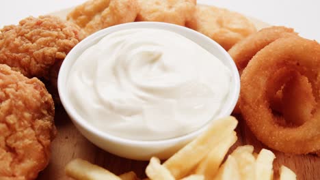 crispy fried chicken, onion rings, and french fries with mayo dip