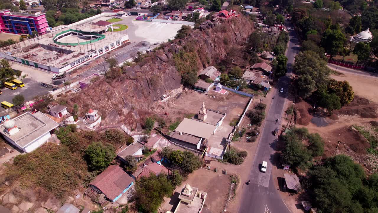 Ravi Dham Ashram with Jabalpur view point and Little World School at Tilwara ghat, jotpur, Jabalpur, Madhya Pradesh, india. day time, moving up, tilt down, drone shot, 4k.