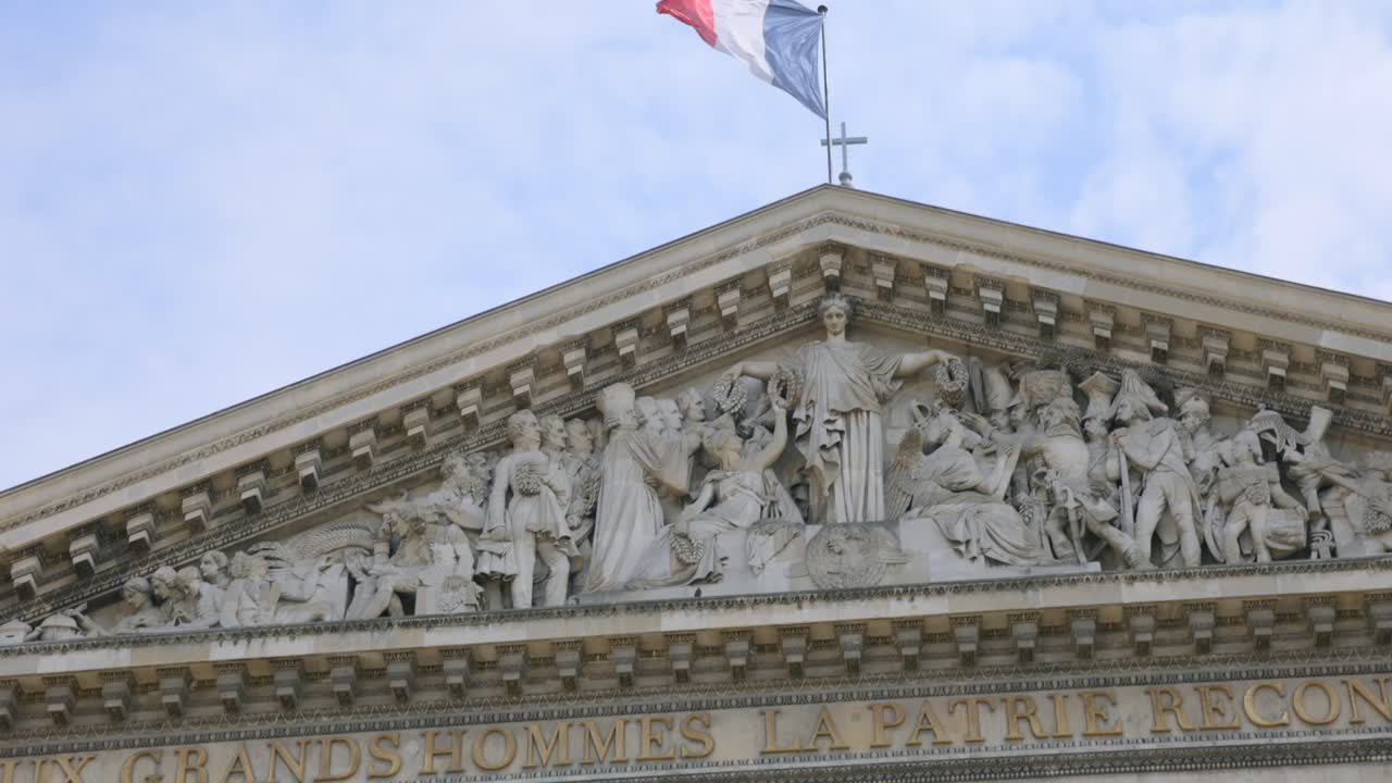 Majestic facade of the Pantheon in Paris, showcasing neoclassical architecture and the inscription Aux Grands Hommes, honoring prominent figures