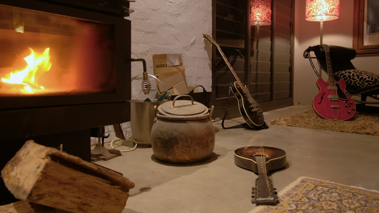 Musical instruments left strewn around a lounge room after rehearsal