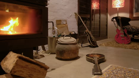 musical instruments left strewn around a lounge room after rehearsal
