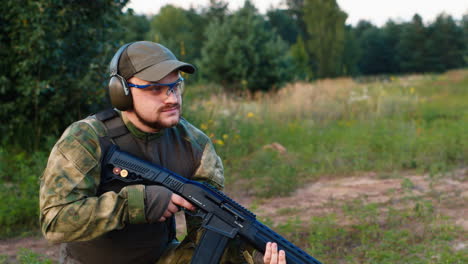 soldier fires a rifle