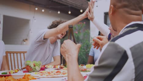 friends enjoying a backyard dinner party