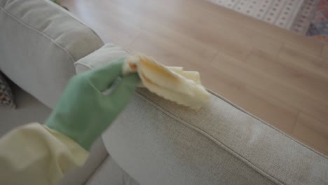 cleaning a light gray sofa