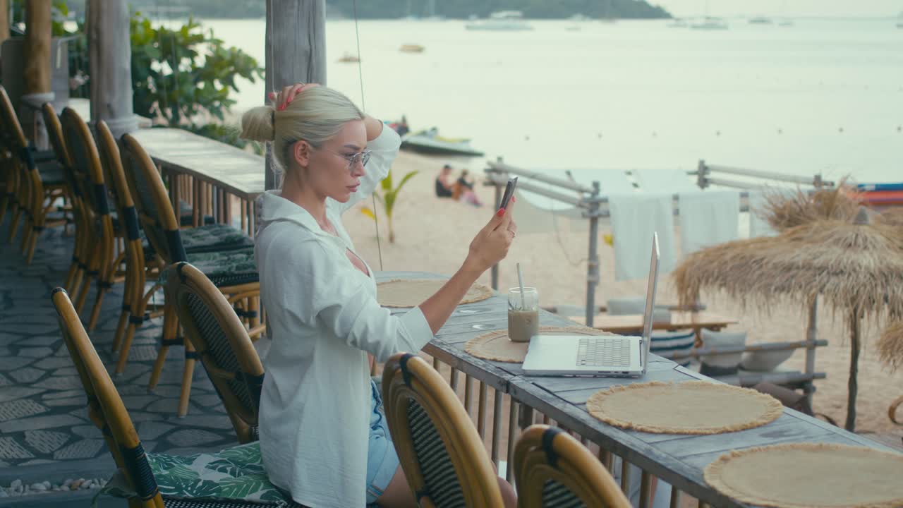 Woman working on a beach cafe