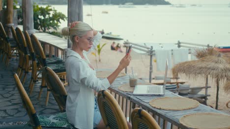woman working on a beach cafe