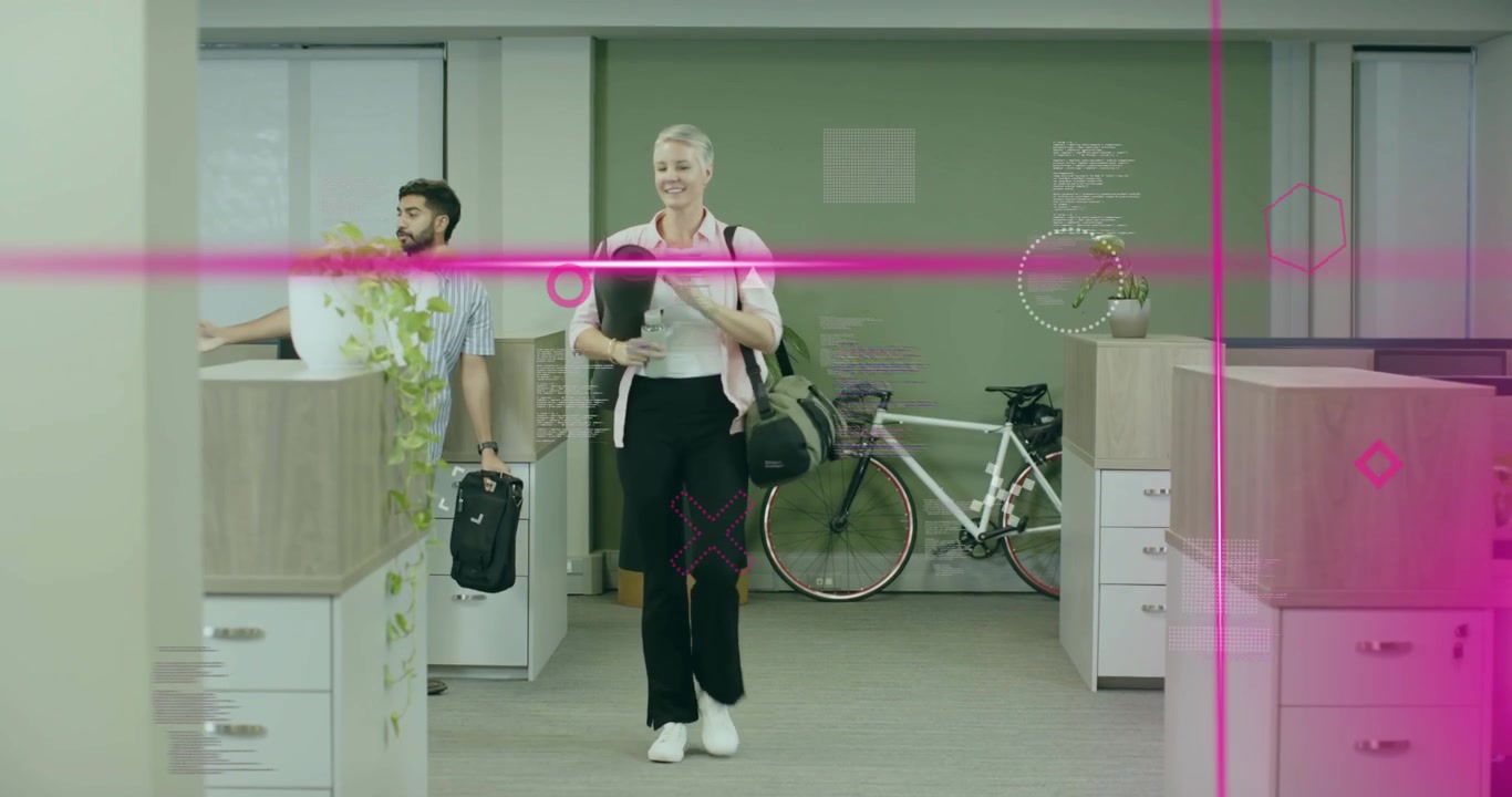 Office worker entering office carrying yoga mat and bag, greeting colleague before yoga session