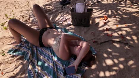 curvy beach model relaxing in palm tree shade tropical nature destination holiday