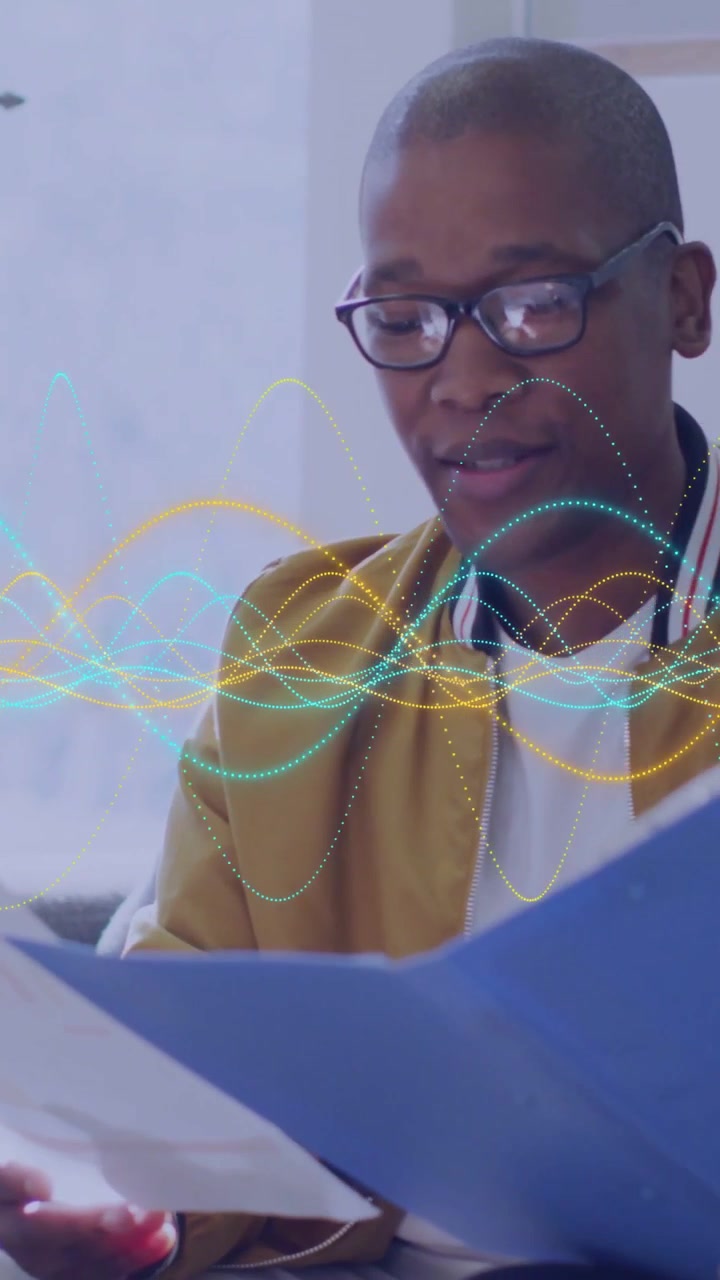 Vertical video: Man speaking and studying blue folder, waveforms overlaying as biz team reviewing