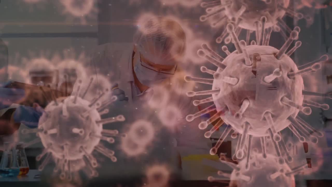 Animazione del coronavirus Covid-19 in diffusione con un operatore sanitario sullo sfondo.