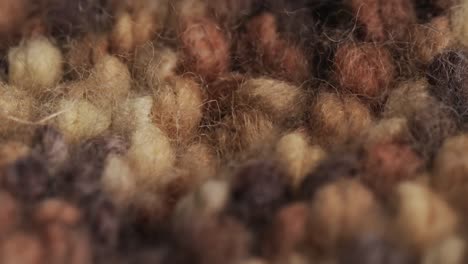 micro video of close up of brown wooly crochet fabric with copy space