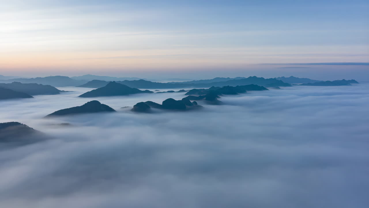 Mountain Peaks Emerging from a Sea of Clouds