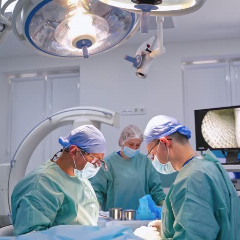 surgery team operating in room