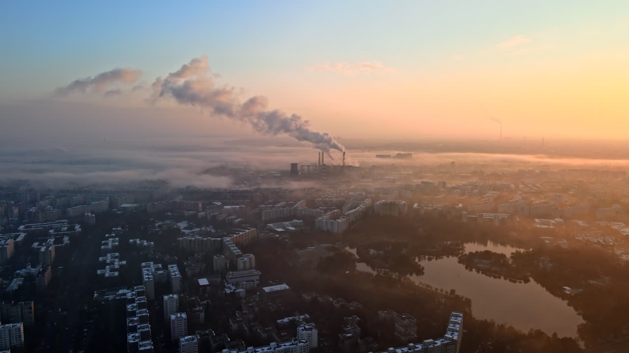Cityscape of Bucharest from a drone, rows of residential buildings, thermal station with fog getting out and other the ground, ecology idea, Romania