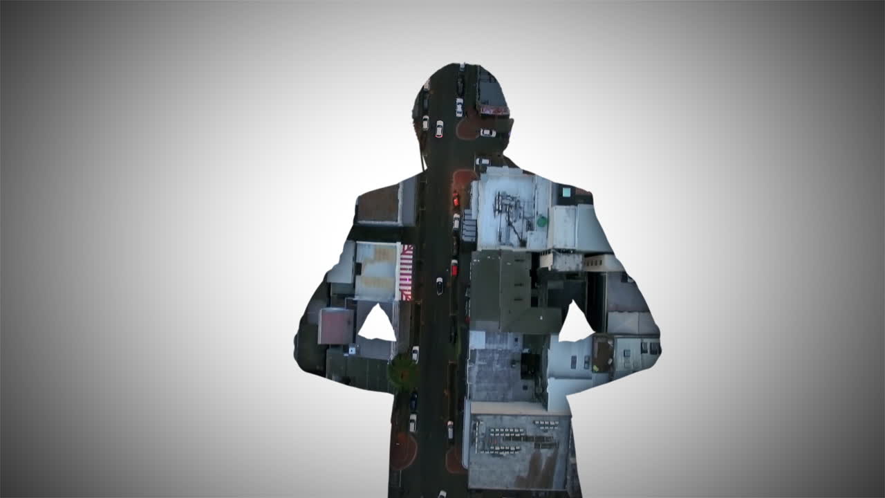 Businessman Silhouette with Cityscape Overlay