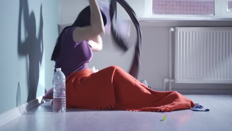 woman having a nervous breakdown is messing around at home.