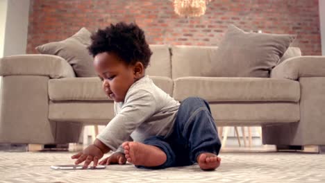 -Baby-boy-playing-with-mobile-phone