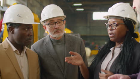 International Team of Engineers Speaking at Factory