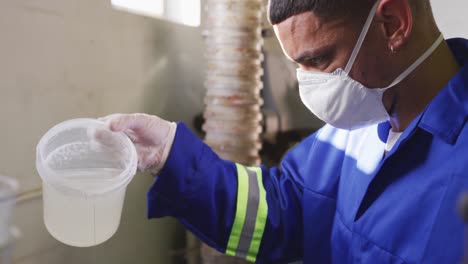 mixed race man working in factory