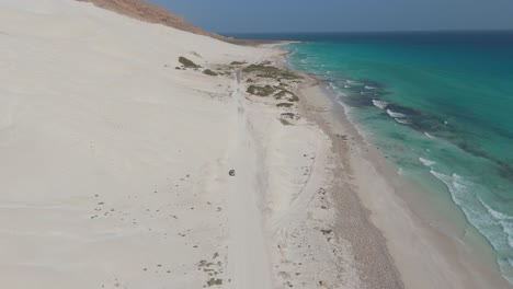 Aerial-flyover-white-sandy-beach-and-dunes-of-socrota-in-Yemen